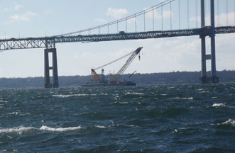 Donjon salvages sunken barge under Newport Pell Bridge